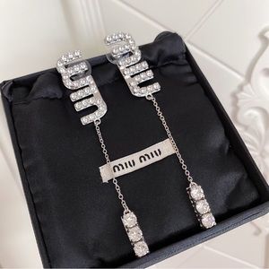 Miu Miu pendant earrings with crystals